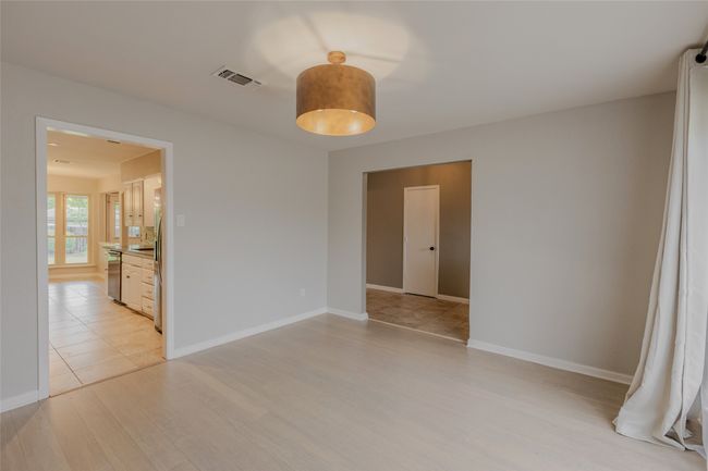 Empty room with light wood-style flooring and baseboards | Image 8