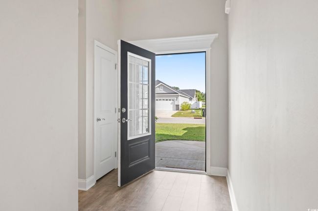Entryway with baseboards and wood finished floors | Image 6