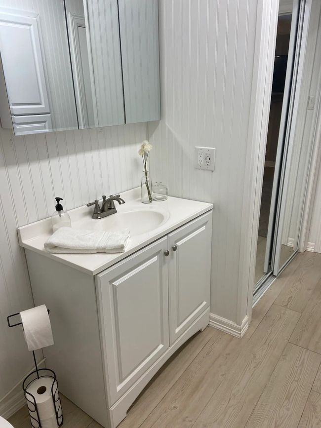 Bathroom featuring hardwood / wood-style flooring and vanity | Image 14