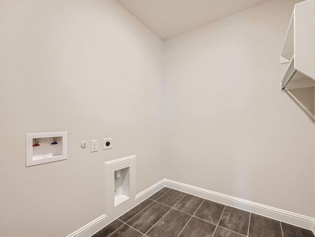 Laundry room featuring baseboards, washer hookup, hookup for a gas dryer, laundry area, and electric dryer hookup | Image 25