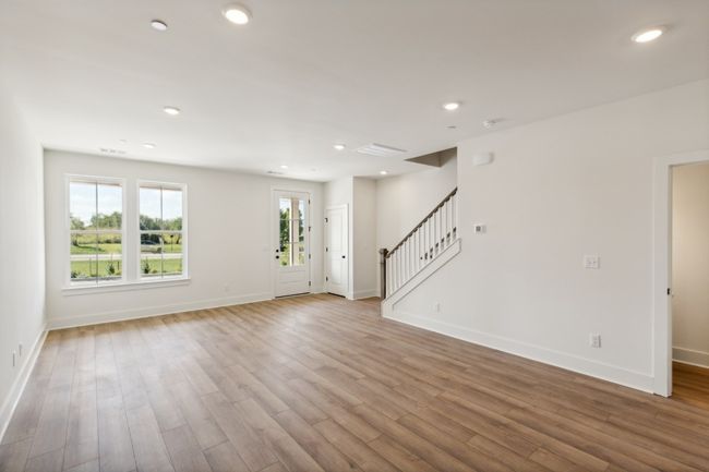 Another view of your open living room. Clean, modern, and spacious-- why should your home be anything else? Actual photo of home. | Image 6