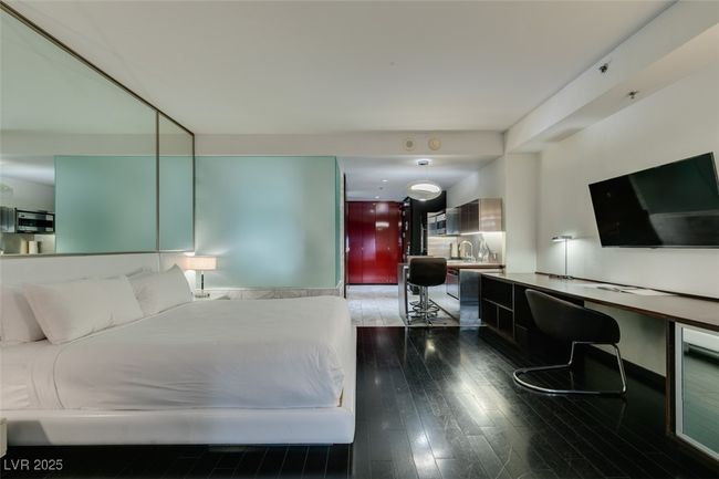Bedroom featuring wood-type flooring and wine cooler | Image 21