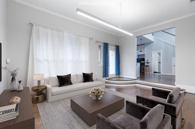 Living room with wood finished floors and ornamental molding | Image 40