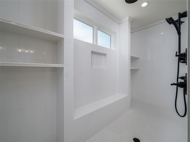 Bathroom featuring a tile shower | Image 20