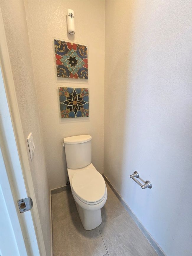 Bathroom with toilet and tile patterned floors | Image 20