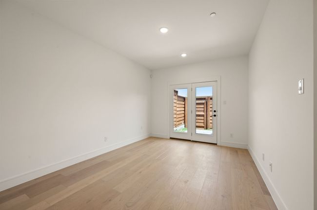 On them main level you will find a flex space that offers access to your private, fenced outside area. | Image 5