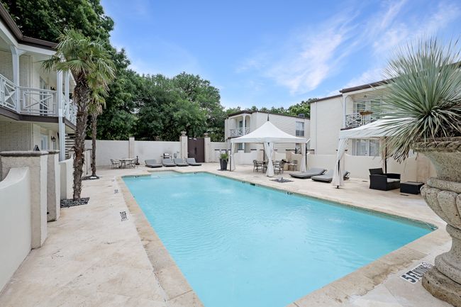 View of swimming pool with a patio area and outdoor dining space | Image 18