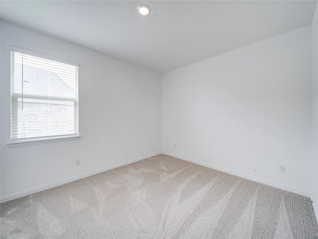 Spare room featuring light carpet and baseboards | Image 33