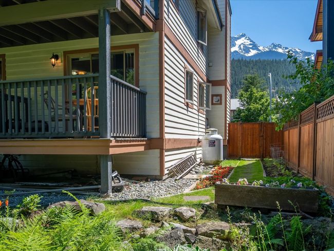 View of side of property featuring a mountain view and fence | Image 29
