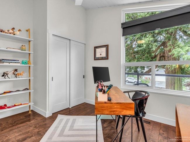 Gorgeous west facing bedroom looking onto the stunning tree outside with new ceiling fan, lighting, baseboards.... . Very private and bright with new large window, new closet system and doors! | Image 29