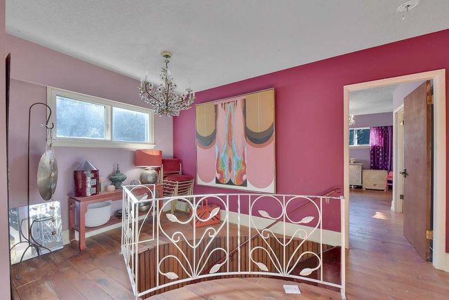 Bedroom with a chandelier and wood-type flooring | Image 30