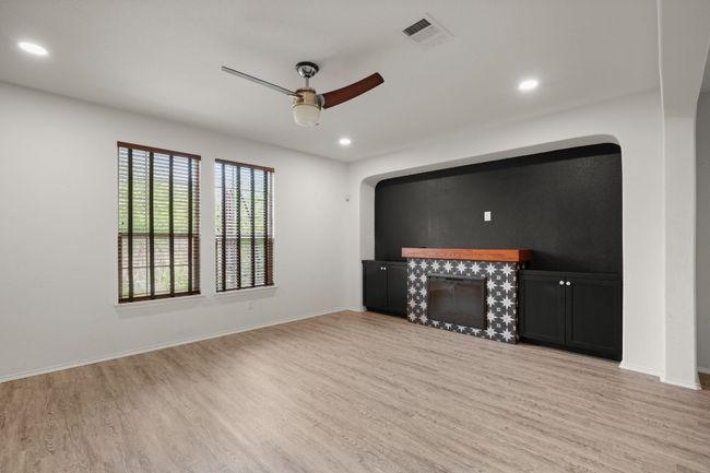 Unfurnished living room with visible vents, a ceiling fan, recessed lighting, and light wood-type flooring | Image 20