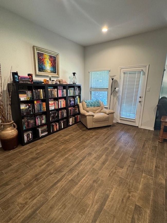 Living area with wood finished floors and recessed lighting | Image 11