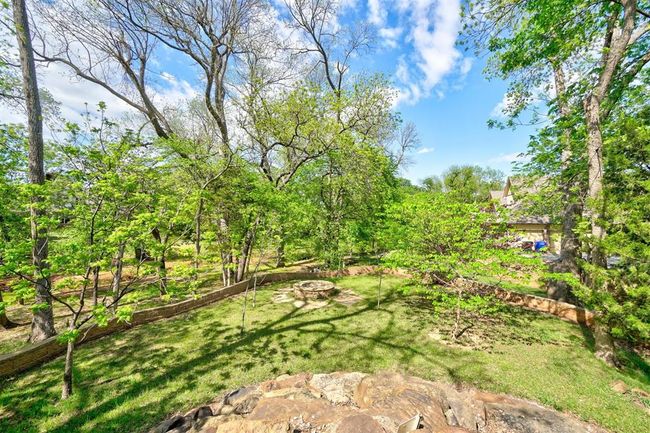 View of yard with an outdoor fire pit | Image 47