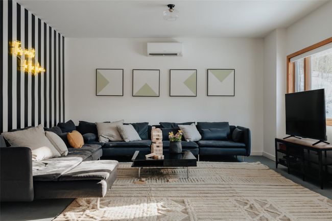 Basement room featuring a wall unit AC | Image 23