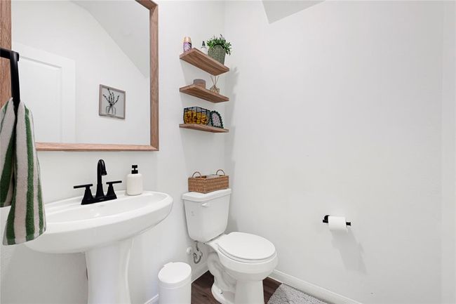 Convenient half bath located on the main floor for guests. | Image 15