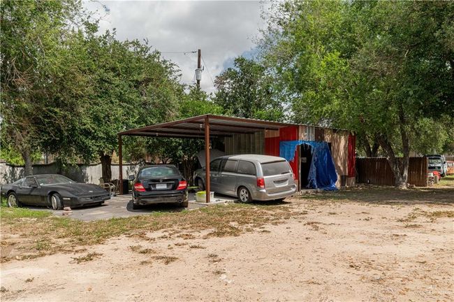 View of parking / parking lot with a carport | Image 8