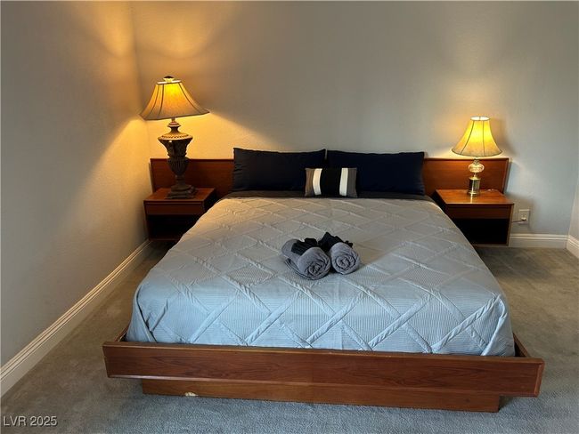 Bedroom featuring carpet flooring and baseboards | Image 15