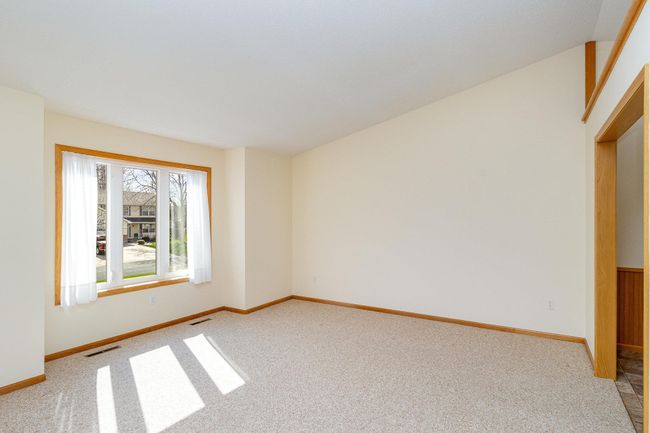 East facing living room with vaulted ceiling. | Image 5