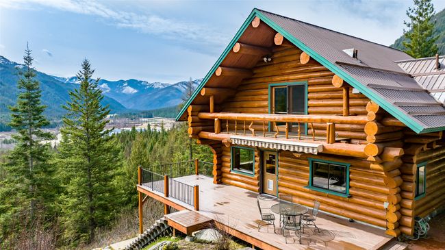 View of home's exterior featuring a deck with mountain view | Image 35
