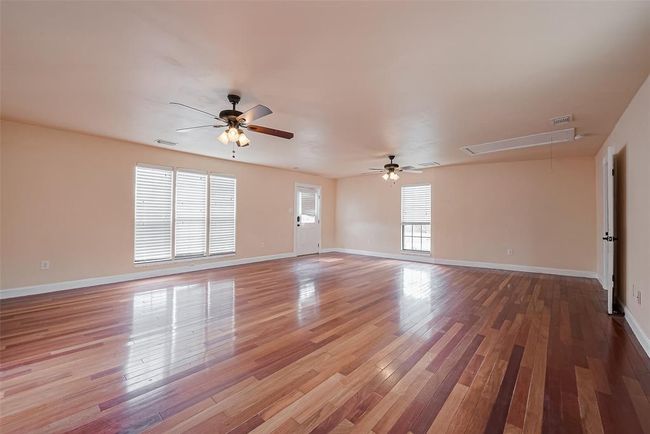 Door that you see leads to the back stair case. Provides a private entry if needed. | Image 46