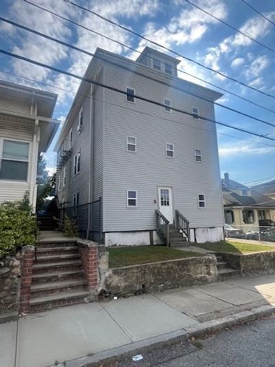 75 Winthrop Street, Home with 12 bedrooms, 4 bathrooms and 3 parking in Woonsocket RI | Image 1