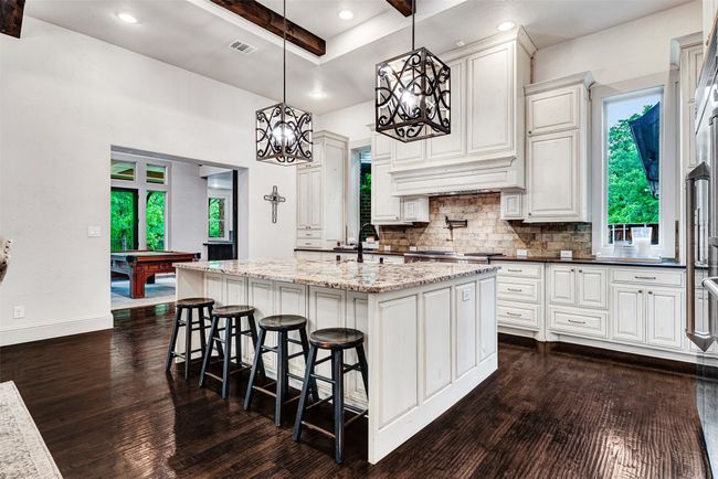 The kitchen will make everyone a gourmet chef! You can't help it when you have high-end appliances and storage space for all your cooking and baking stuff. | Image 16