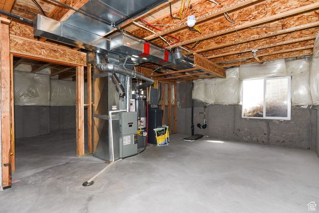 Below grade area featuring heating unit and gas water heater | Image 28