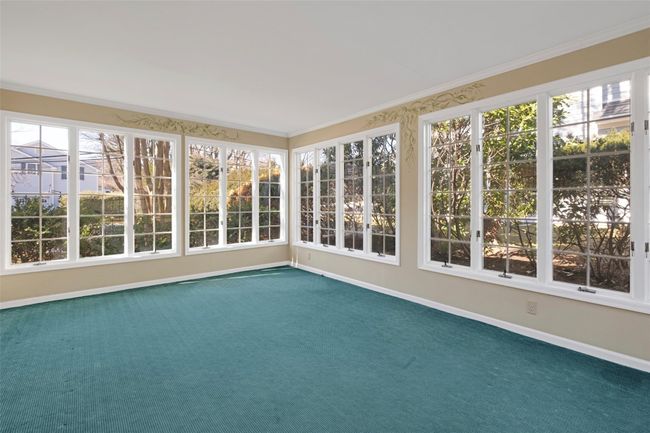 View of unfurnished sunroom | Image 5
