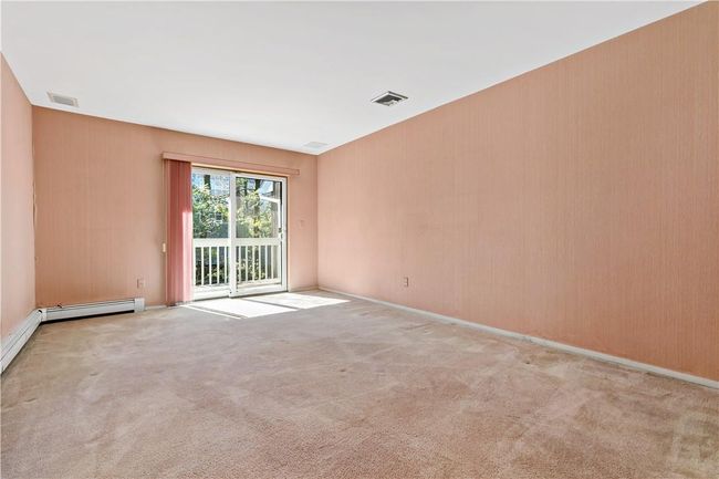 Primary bedroom with balcony and en-suite bathroom. | Image 18