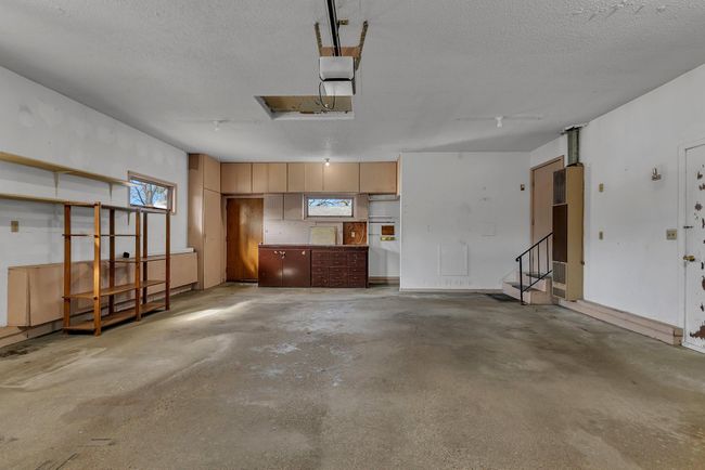Oversized 2 car garage (24x28) with extra storage, service doors and stairs to basement | Image 28