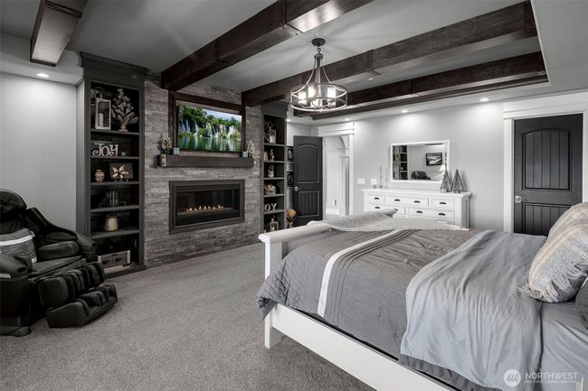 Primary room complete with beautiful fireplace and built ins. | Image 12