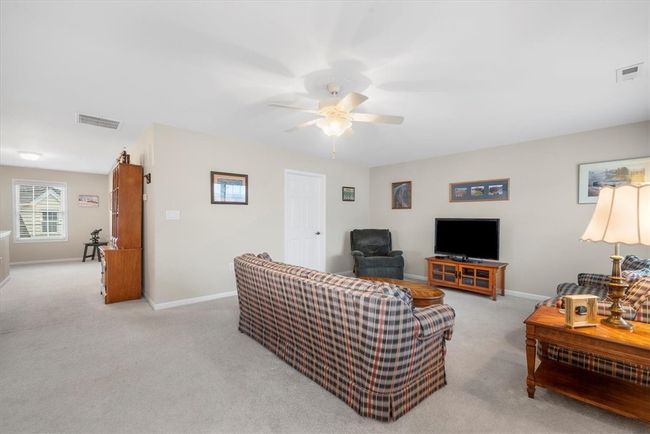 Notice the spacious hallway with room for additional furniture or a home library. An 8x6 walk in closet boasts additional storage. | Image 29