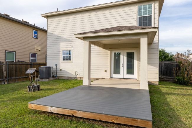 Rear view of property with central air condition unit and french doors | Image 31