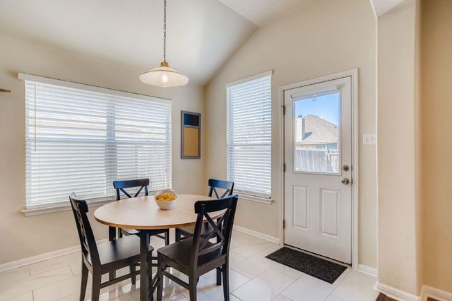 Dining space featuring plenty of natural light and lofted ceiling | Image 12