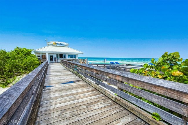 Dock area featuring a water view | Image 45