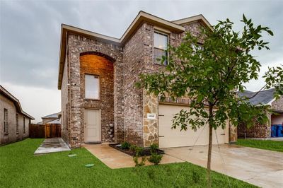 View of front of property with a garage and a front yard | Image 2