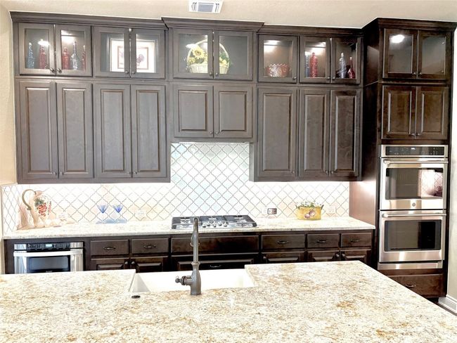 Wooden Kitchen Cabinets, with Lighting under cabinets and Glass doors on upper cabinets with lights | Image 17
