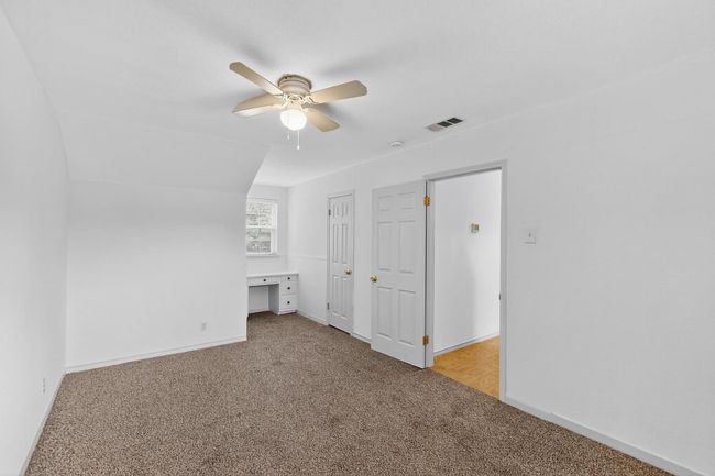 Bonus room featuring light colored carpet and ceiling fan | Image 19
