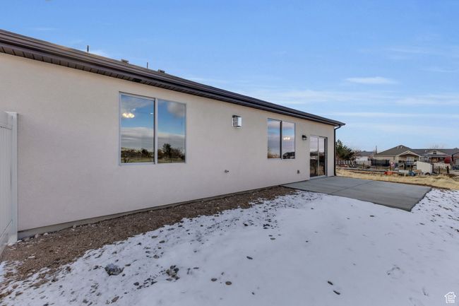Snow covered property with a patio | Image 31