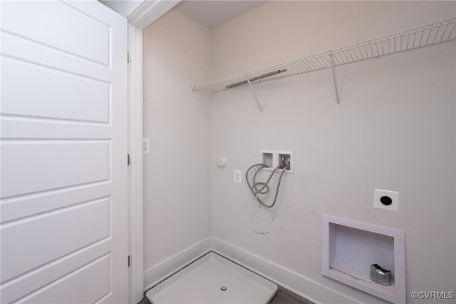 Laundry area featuring electric dryer hookup, hookup for a washing machine, and gas dryer hookup | Image 20