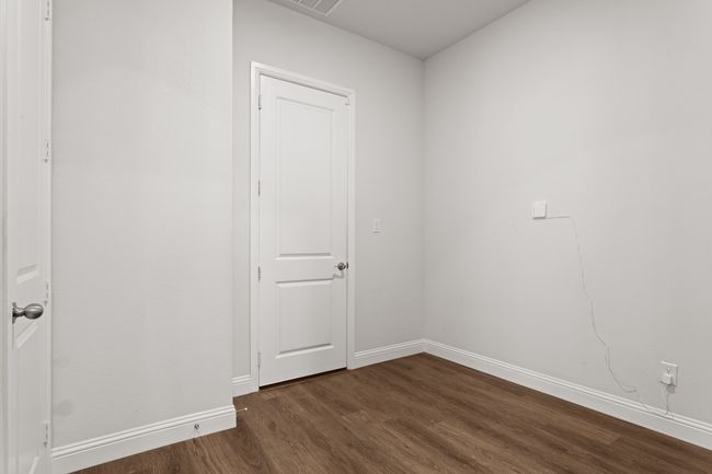 This is the door to the garage, and the space is a large mud room with another closet. | Image 22