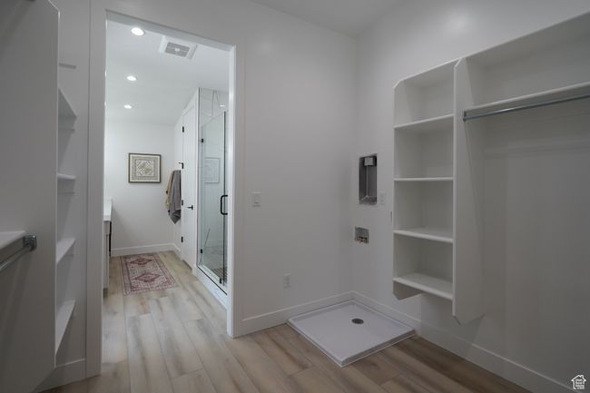 Mudroom with light wood-type flooring, baseboards, and recessed lighting | Image 12