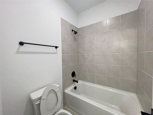 Bathroom with toilet and tub / shower combination | Image 22