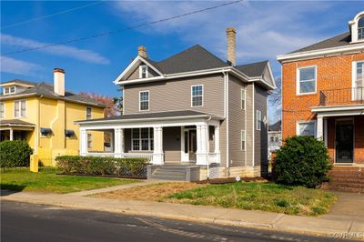 View of front facade featuring a front lawn and a porch | Image 2