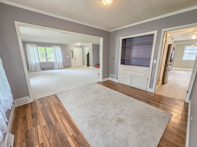 Dining Room with Access to Living Room and Kitchen | Image 8