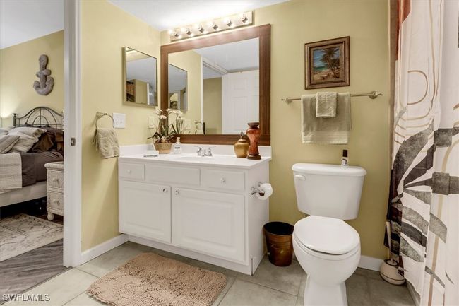 Bathroom featuring ensuite bath and vanity | Image 14
