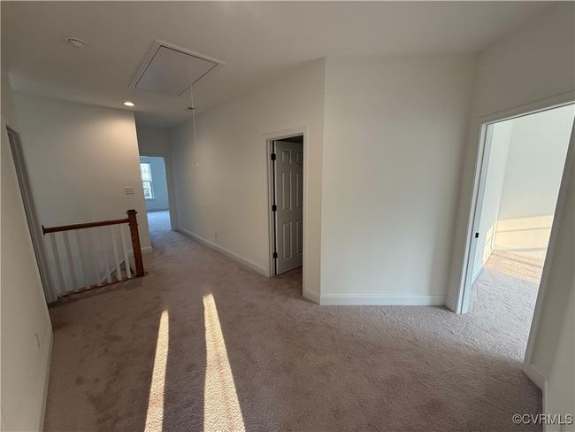 Empty room with attic access, carpet floors, recessed lighting, and baseboards | Image 9