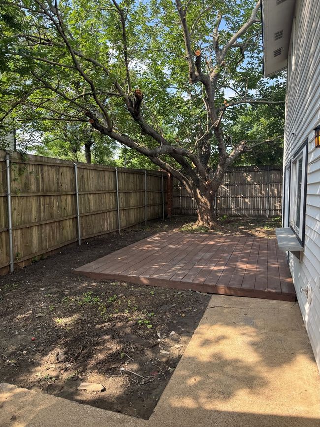 View of fenced backyard | Image 18