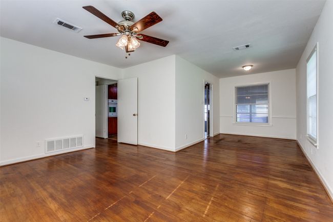 Living room is connected to the dining area. | Image 5